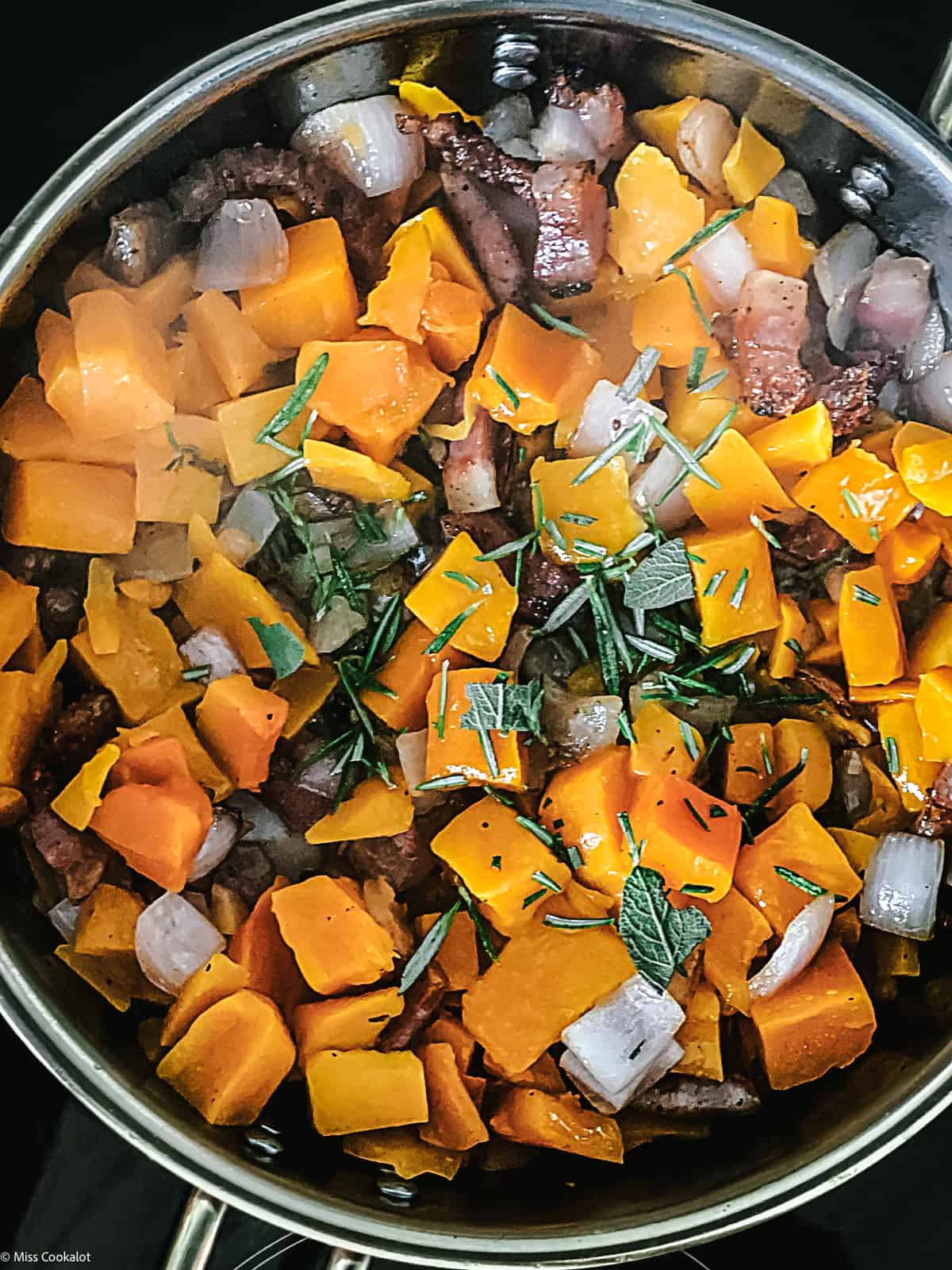 Pumpkin cubes and guanciale pieces
chopped onion and garlic in a deep sauce pan.